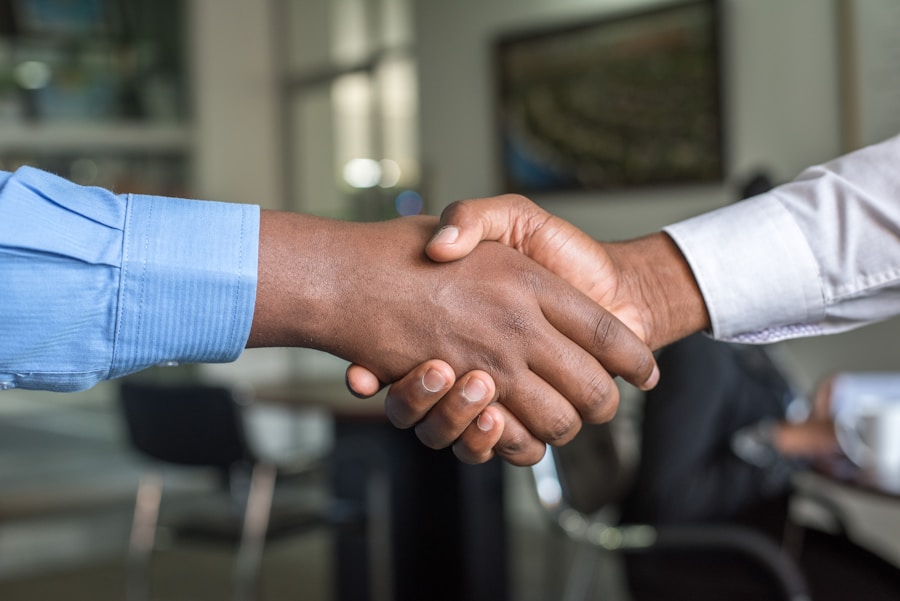 Attorney and client shaking hands — professional legal consultation